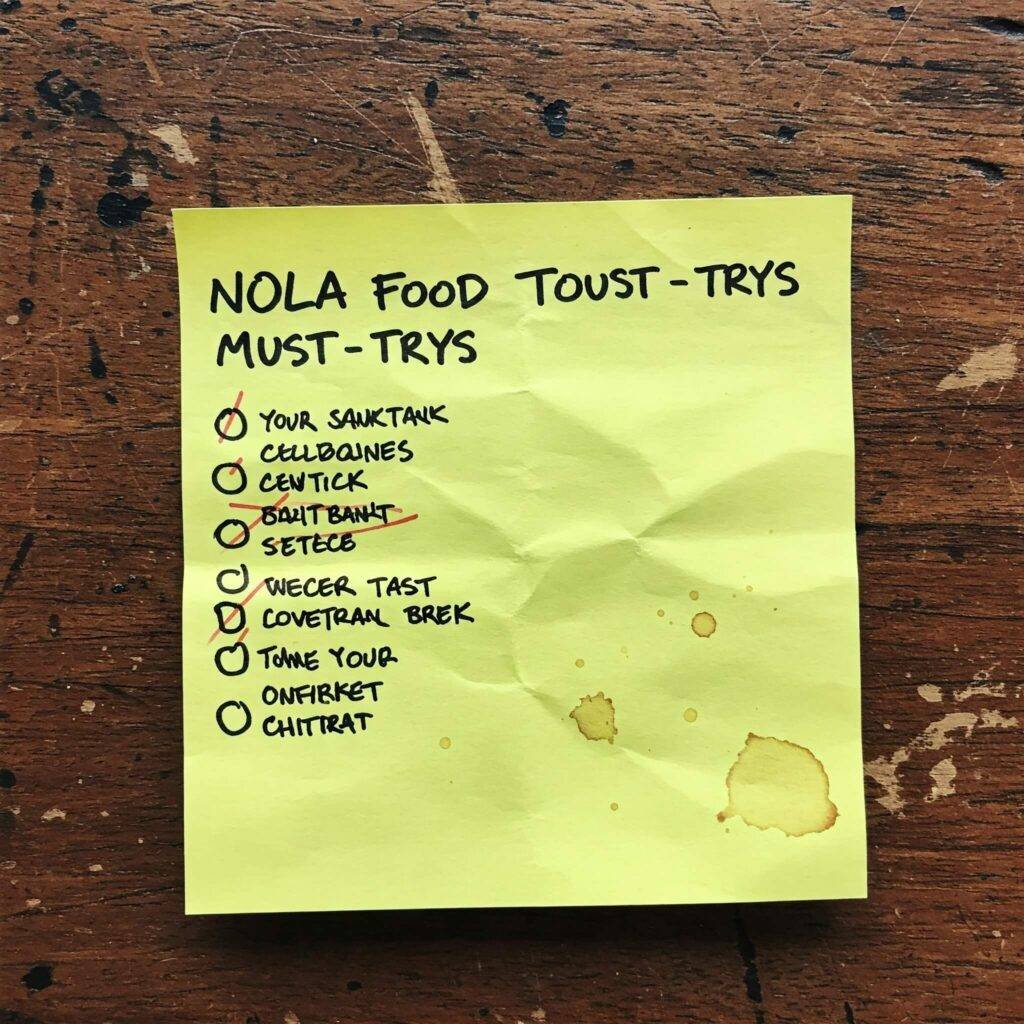 NOLA Food Tour must-try list on sticky note.