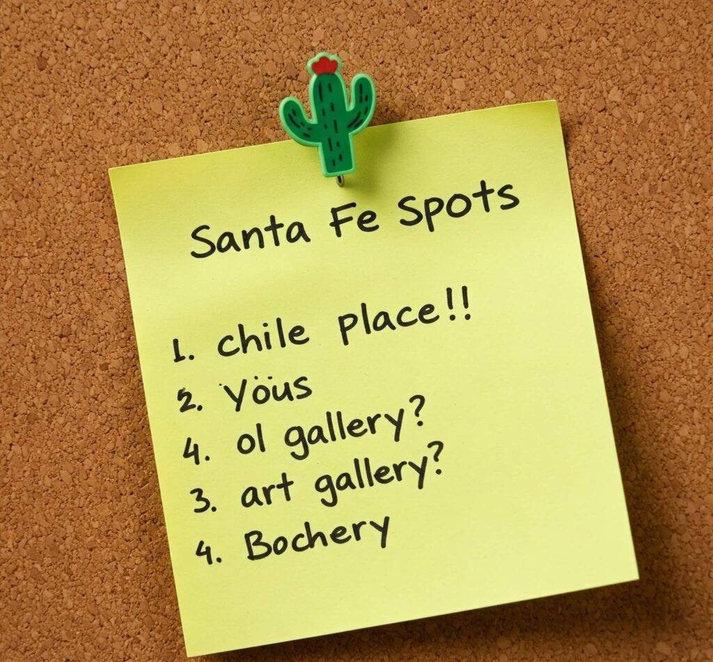 Santa Fe plan sticky note on corkboard